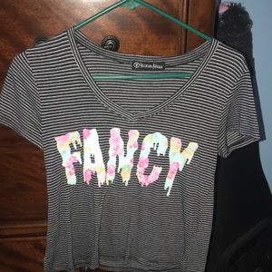 Striped t-shirt, with the word fancy across it.